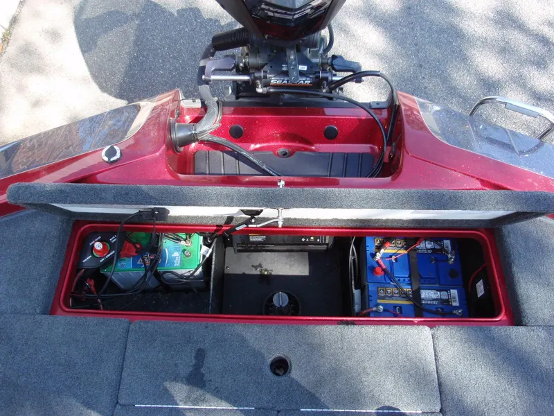 Slide: The Image of 2017 Ranger Z518 Comanche boat battery compartment with visible wiring and equipment. - 17