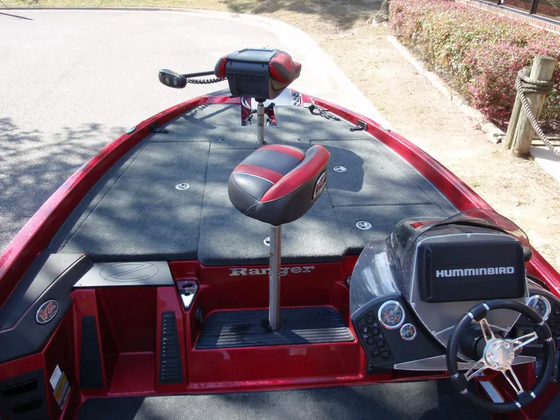 Slide: The Image of 2017 Ranger Z518 Comanche boat interior with Humminbird electronics and red-black seating. - 7