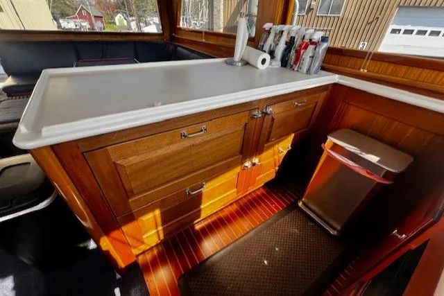 Slide: The Image of 2003 Lyman-Morse Wesmac Sportfish Cruiser interior with wooden cabinetry and countertop. - 10