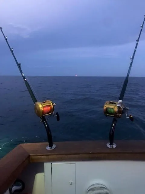 Slide: The Image of Fishing rods on a 2003 Lyman-Morse Wesmac Sportfish Cruiser at sea. - 25