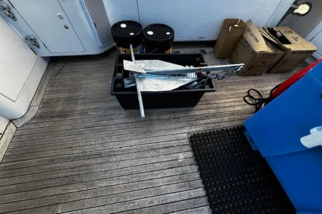 Slide: The Image of 2003 Lyman-Morse Wesmac Sportfish Cruiser deck with equipment and storage boxes. - 32