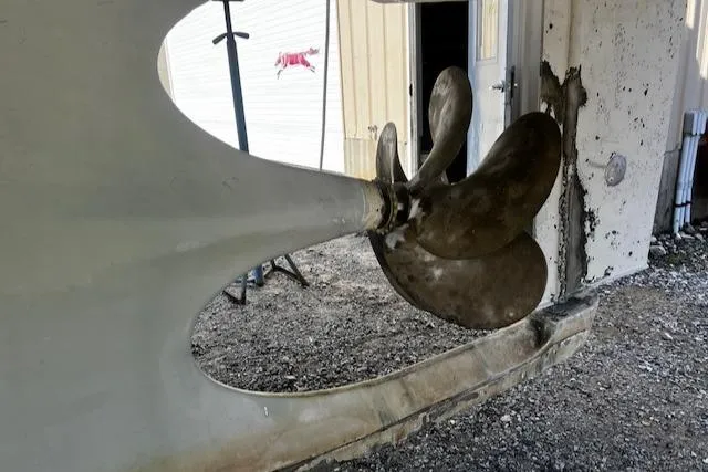 Slide: The Image of Propeller of 2003 Lyman-Morse Wesmac Sportfish Cruiser in a maintenance area. - 36