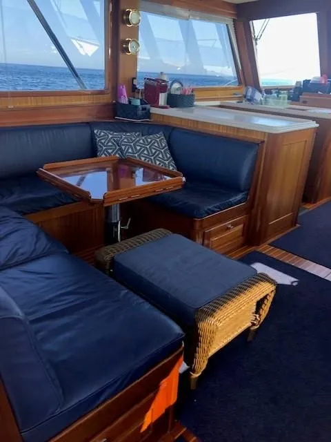 Slide: The Image of Luxurious 2003 Lyman-Morse Wesmac Sportfish Cruiser interior with leather seating and wooden accents. - 4