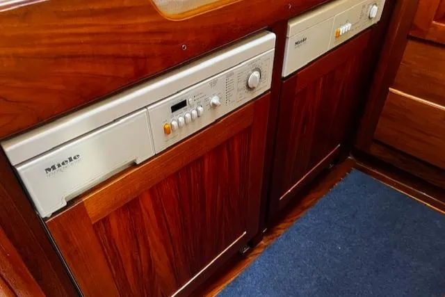 Slide: The Image of 2003 Lyman-Morse Wesmac Sportfish Cruiser interior with Miele appliances and wooden cabinetry. - 41