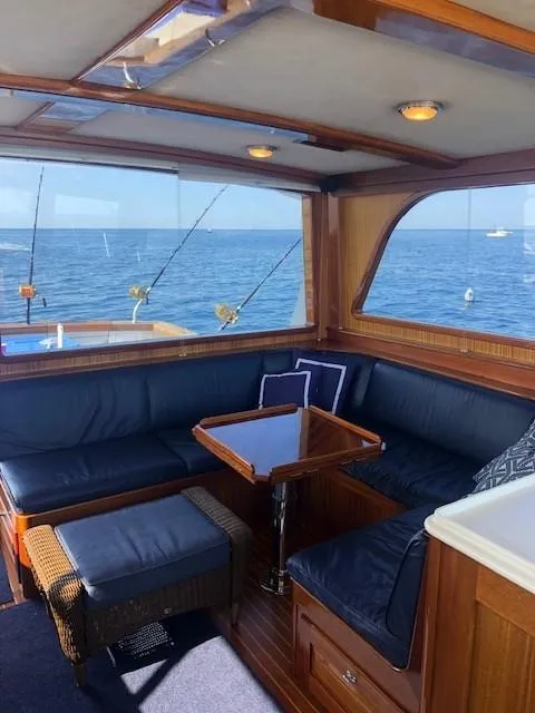 Slide: The Image of Luxurious 2003 Lyman-Morse Wesmac Sportfish Cruiser interior with ocean view and comfortable seating. - 5