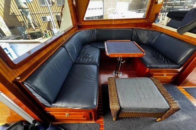 Slide: The Image of Luxurious 2003 Lyman-Morse Wesmac Sportfish Cruiser interior with leather seating and wooden accents. - 8