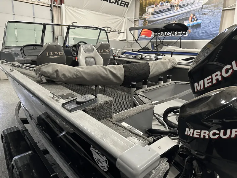 Slide: The Image of 2006 Lund 1800 Sport Angler boat with Mercury engines in showroom. - 14