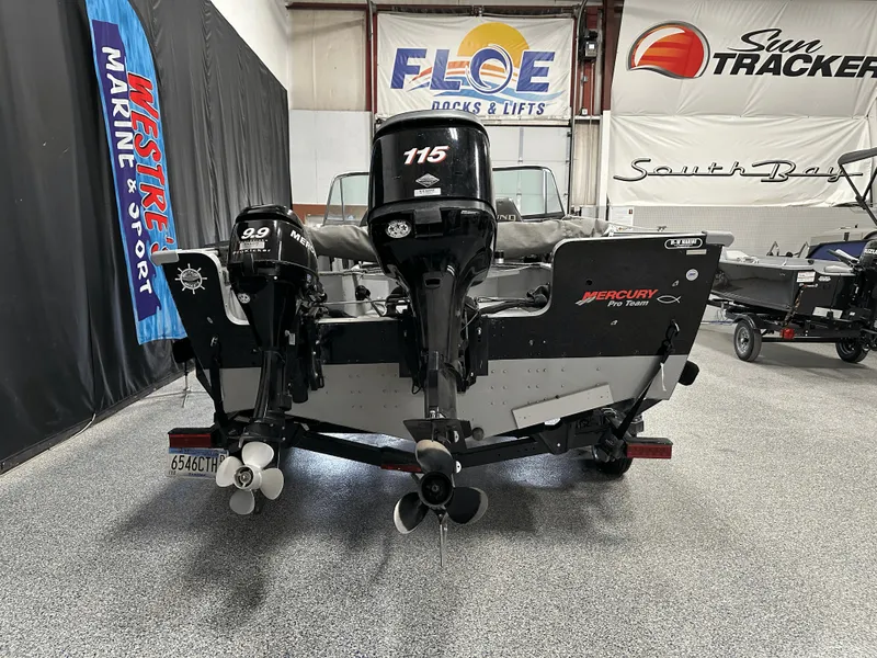 Slide: The Image of 2006 Lund 1800 Sport Angler with dual Mercury outboard motors in showroom. - 4