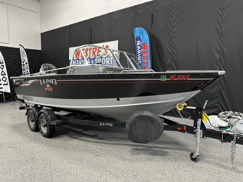 Slide: The Image of 2006 Lund 1800 Sport Angler boat on trailer in showroom display. - 6