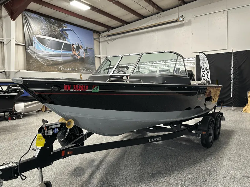 Slide: The Image of 2006 Lund 1800 Sport Angler boat on trailer in indoor showroom. - 8