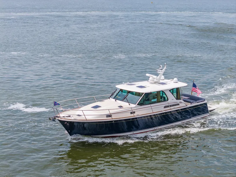 Slide: The Image of 2024 Sabre 43 Salon Express yacht cruising on open water. - 25