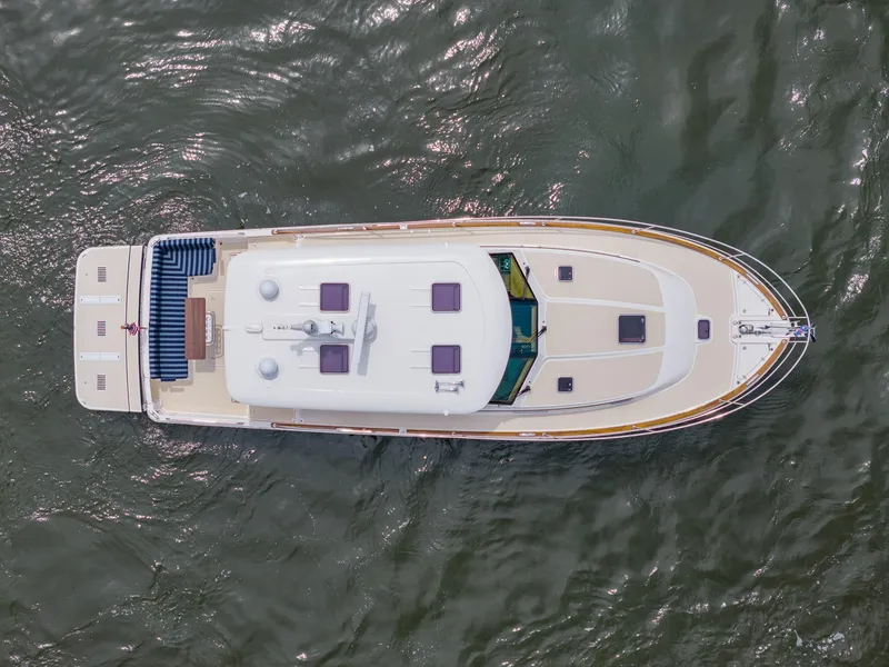 Slide: The Image of Aerial view of 2024 Sabre 43 Salon Express yacht cruising on water. - 27