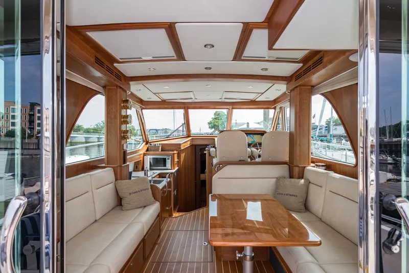 Slide: The Image of 2024 Sabre 43 Salon Express interior with luxurious seating and wooden finishes. - 31