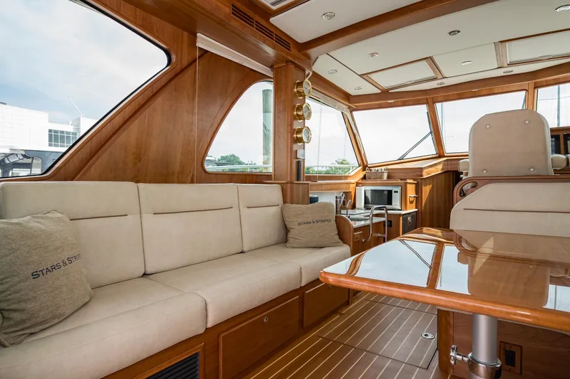Slide: The Image of Luxurious interior of 2024 Sabre 43 Salon Express yacht with plush seating and elegant wood finishes. - 32