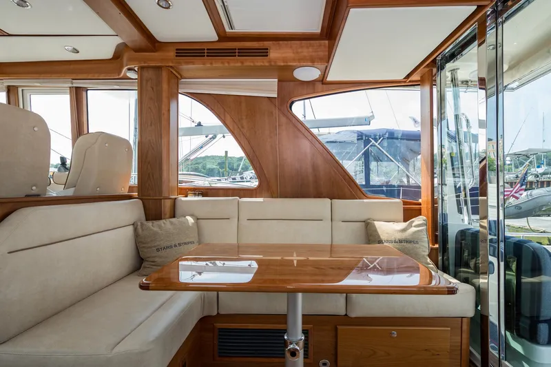 Slide: The Image of Luxurious interior of 2024 Sabre 43 Salon Express yacht with elegant wood and plush seating. - 35