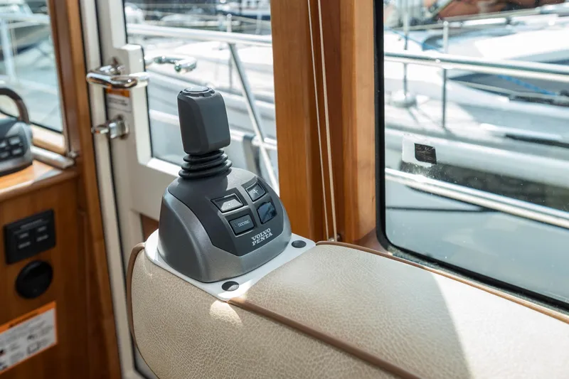 Slide: The Image of 2024 Sabre 43 Salon Express interior joystick control, featuring Volvo Penta system. - 39