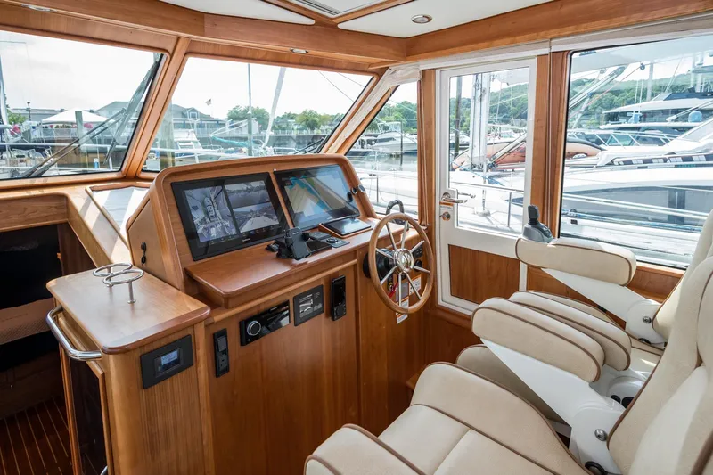 Slide: The Image of 2024 Sabre 43 Salon Express helm with modern controls and luxurious seating. - 41