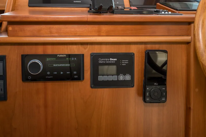 Slide: The Image of 2024 Sabre 43 Salon Express control panel with audio and generator displays. - 43