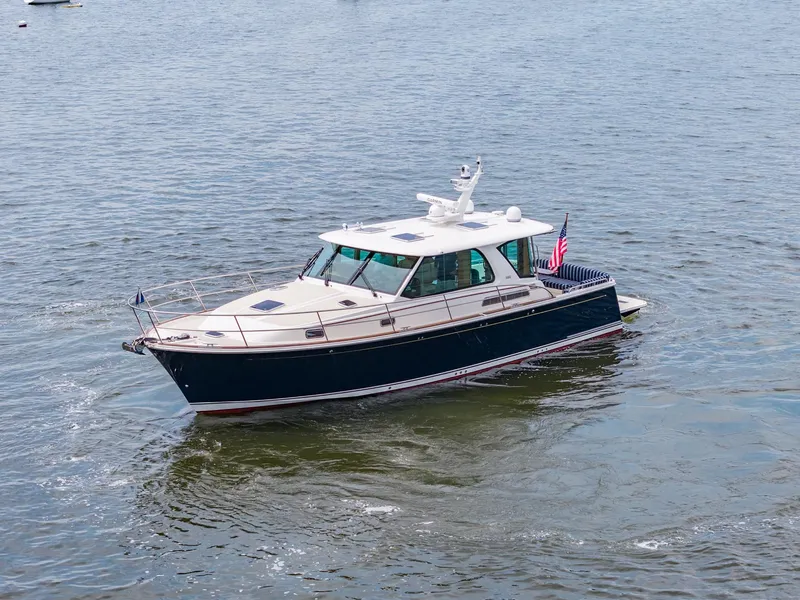 Slide: The Image of 2024 Sabre 43 Salon Express yacht cruising on open water. - 7