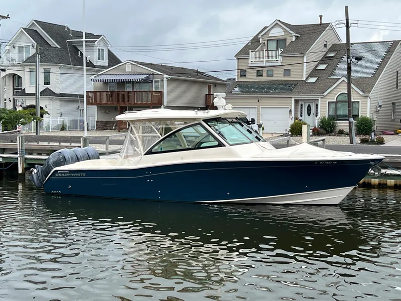 Slide: The Image of 2020 Grady-White Freedom 375 boat docked in a residential marina. - 18