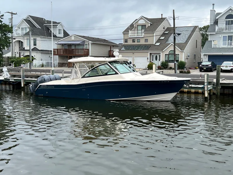 Slide: The Image of 2020 Grady-White Freedom 375 boat docked near waterfront homes. - 19