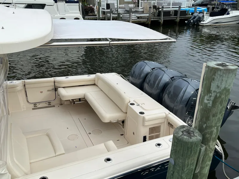 Slide: The Image of 2020 Grady-White Freedom 375 boat with triple engines docked at marina. - 22