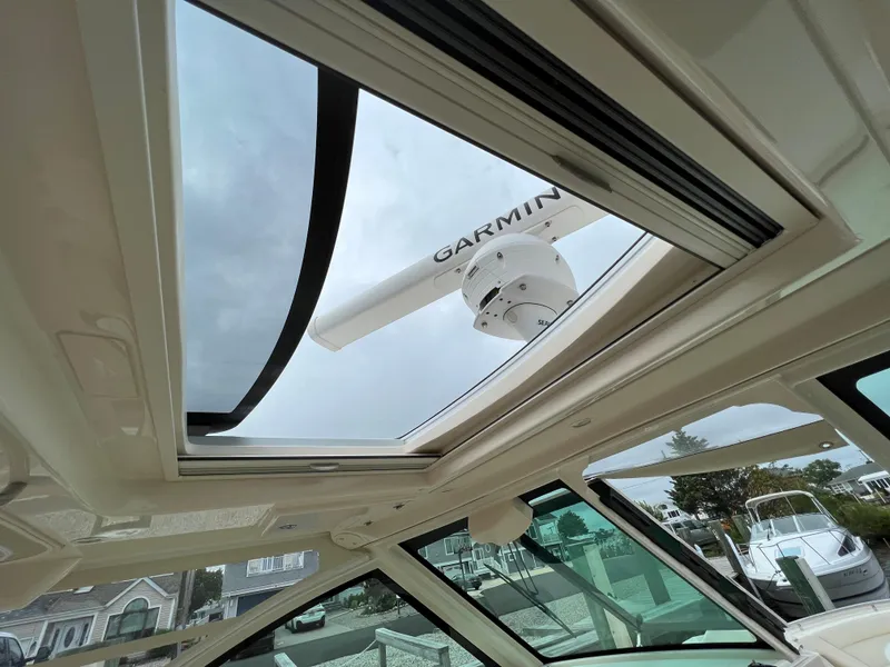 Slide: The Image of 2020 Grady-White Freedom 375 boat with Garmin radar through sunroof. - 24