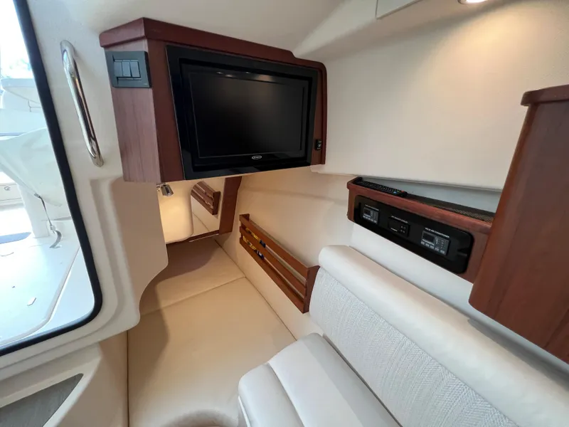 Slide: The Image of 2020 Grady-White Freedom 375 cabin interior with TV and seating area. - 36