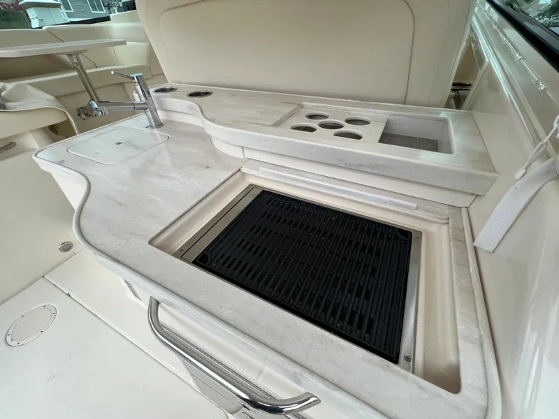 Slide: The Image of Luxury outdoor kitchen on 2020 Grady-White Freedom 375 boat with grill and sink. - 42