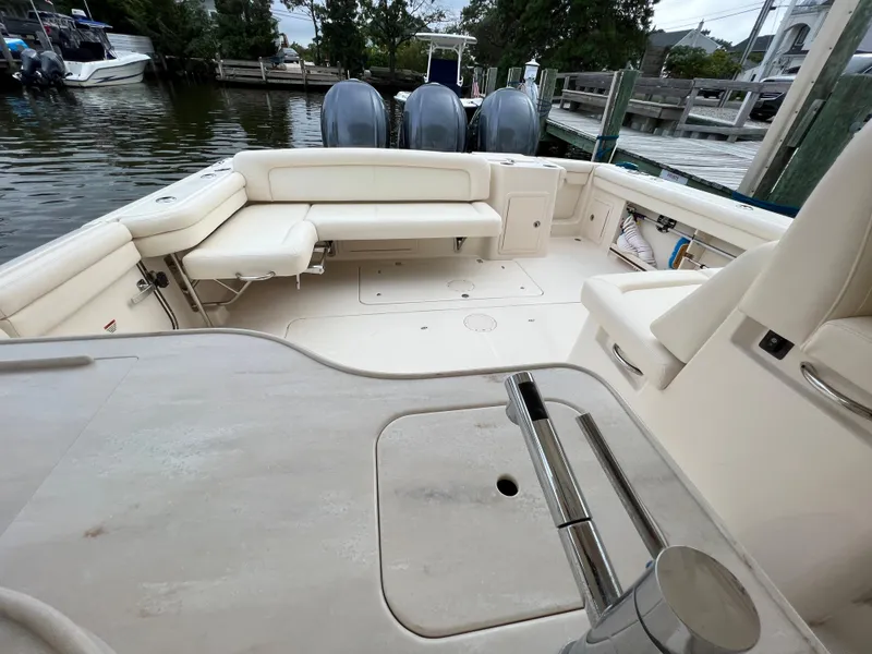 Slide: The Image of 2020 Grady-White Freedom 375 boat interior with seating and outboard motors. - 48