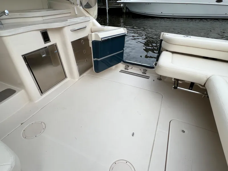 Slide: The Image of 2020 Grady-White Freedom 375 boat interior with seating and storage by the water. - 49