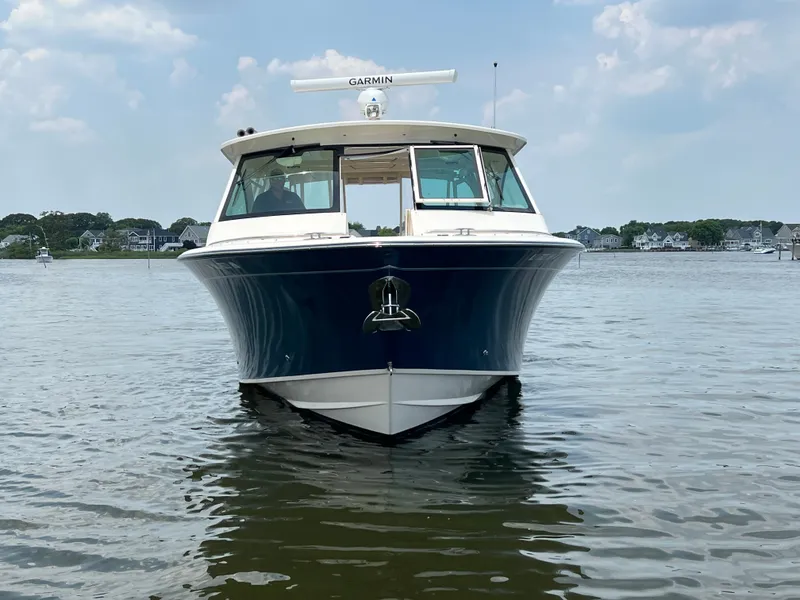 Slide: The Image of 2020 Grady-White Freedom 375 boat on calm water, front view. - 6