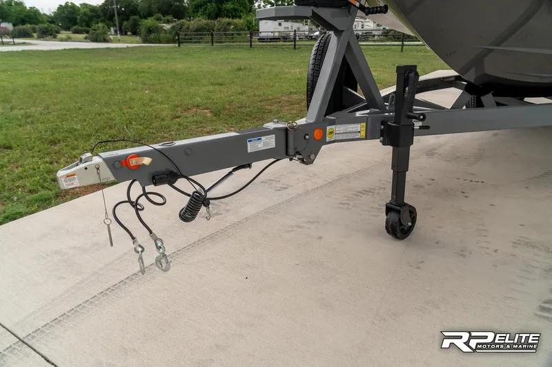 Slide: The Image of Trailer hitch of a 2025 MasterCraft X22 boat on concrete surface. - 21