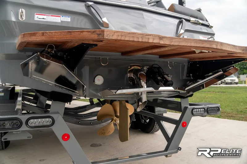 Slide: The Image of 2025 MasterCraft X22 boat stern with propeller and trim tabs. - 32