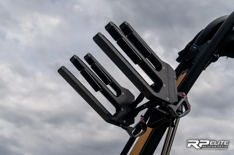 Slide: The Image of 2025 MasterCraft X22 wakeboard rack against cloudy sky. - 37