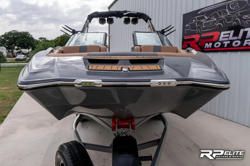 Slide: The Image of 2025 MasterCraft X22 boat on trailer at RP Elite Motors showroom. - 38
