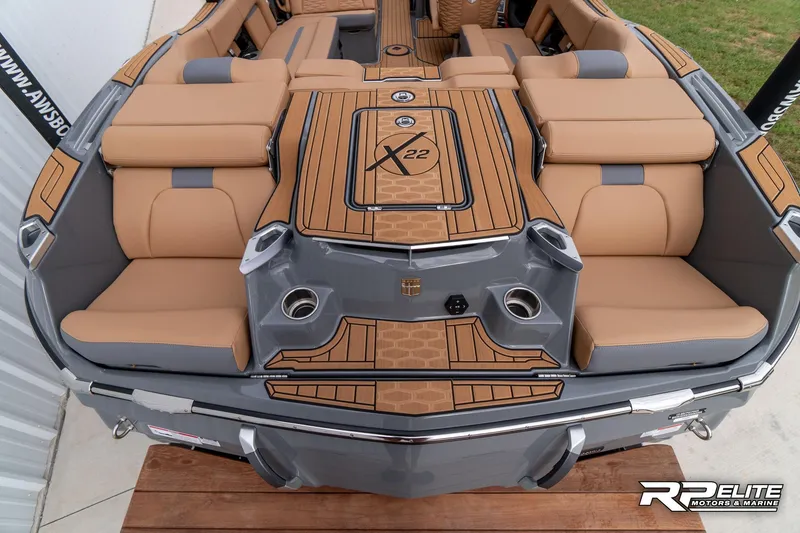 Slide: The Image of 2025 MasterCraft X22 boat with tan seating and sleek design. - 39