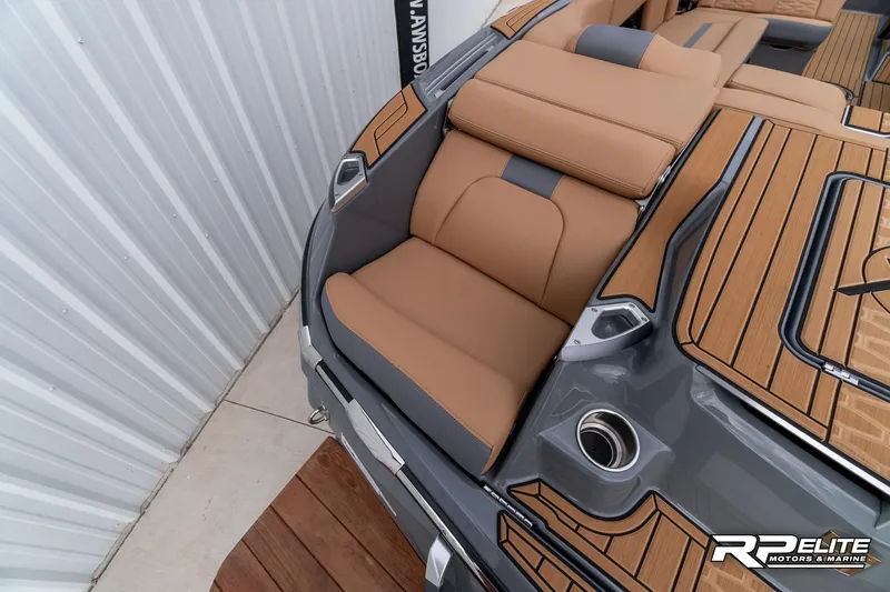 Slide: The Image of 2025 MasterCraft X22 boat interior with tan seating and sleek design. - 42