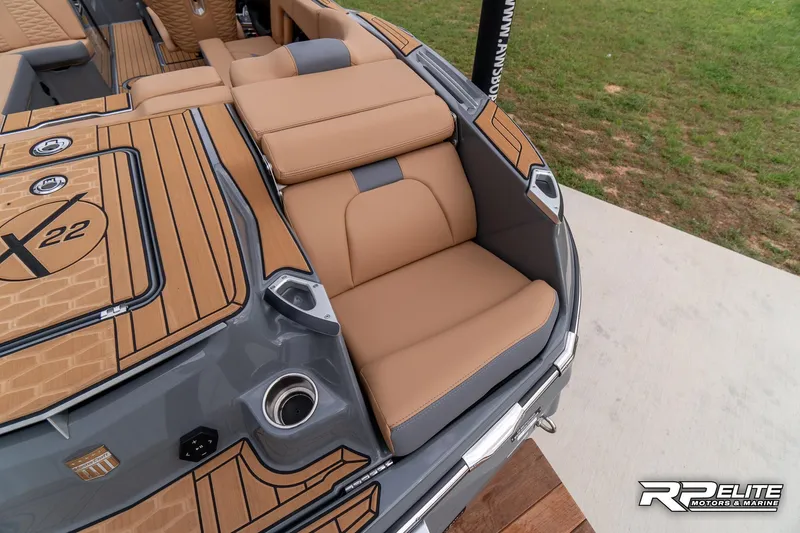 Slide: The Image of 2025 MasterCraft X22 boat interior with tan seating and sleek design. - 44