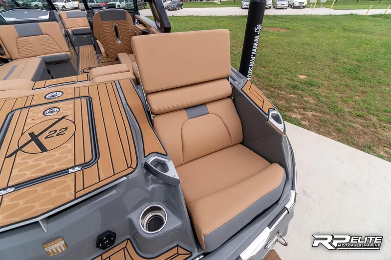 Slide: The Image of 2025 MasterCraft X22 boat with tan seating and sleek design, featuring modern amenities. - 47
