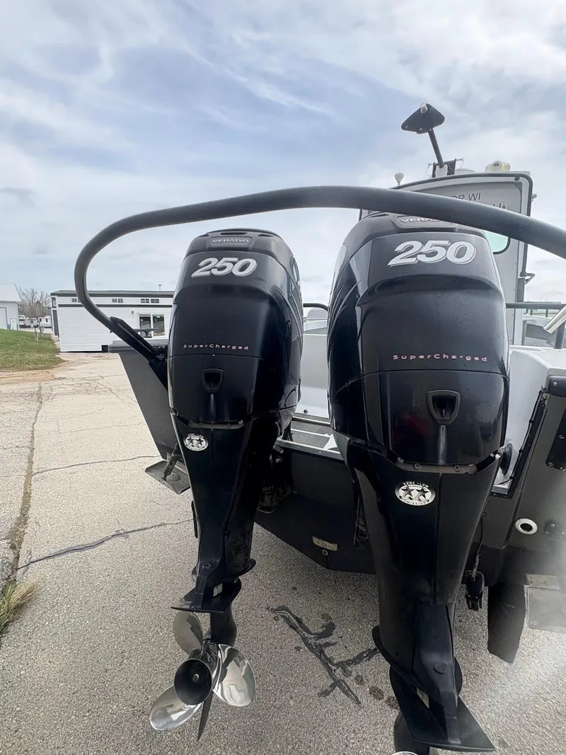 Slide: The Image of 2002 Boston Whaler 27 Vigilant with twin 250 horsepower outboard engines. - 15