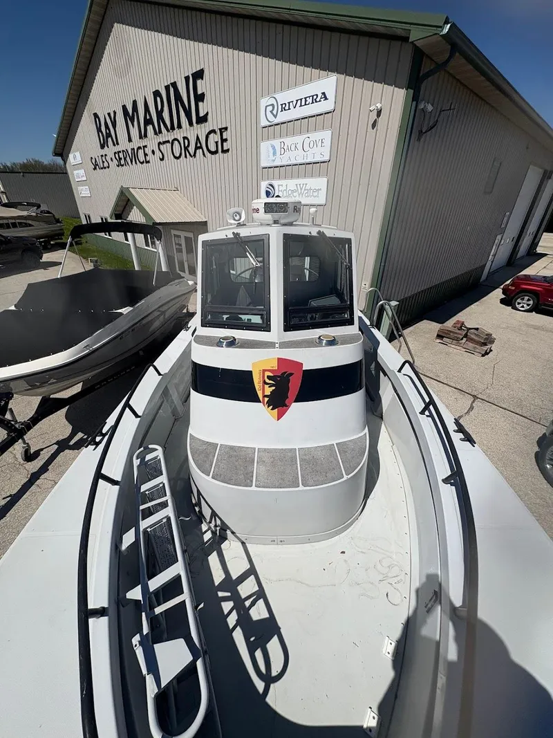 Slide: The Image of 2002 Boston Whaler 27 Vigilant boat at Bay Marine storage facility. - 5
