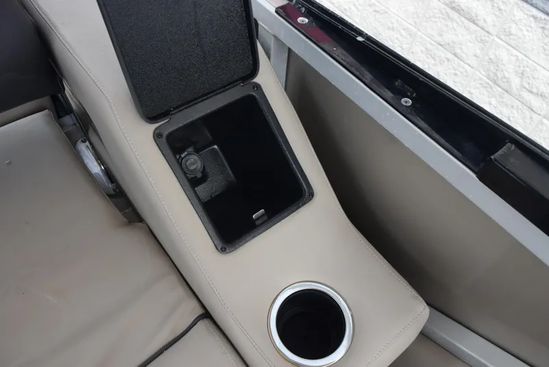 Slide: The Image of Interior of 2022 Silver Wave 2410 SW5 JS boat with storage compartment and cup holder. - 18