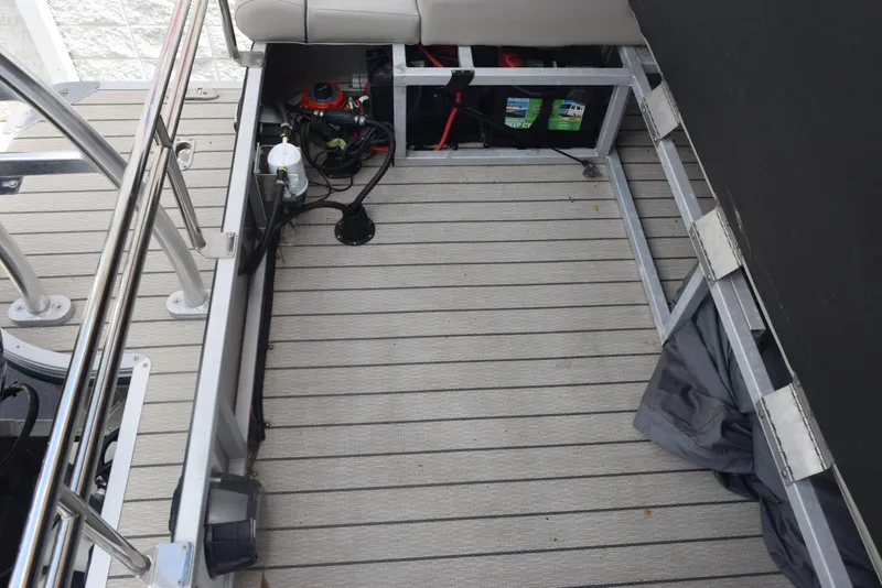 Slide: The Image of 2022 Silver Wave 2410 SW5 JS boat interior with storage compartments and equipment. - 19