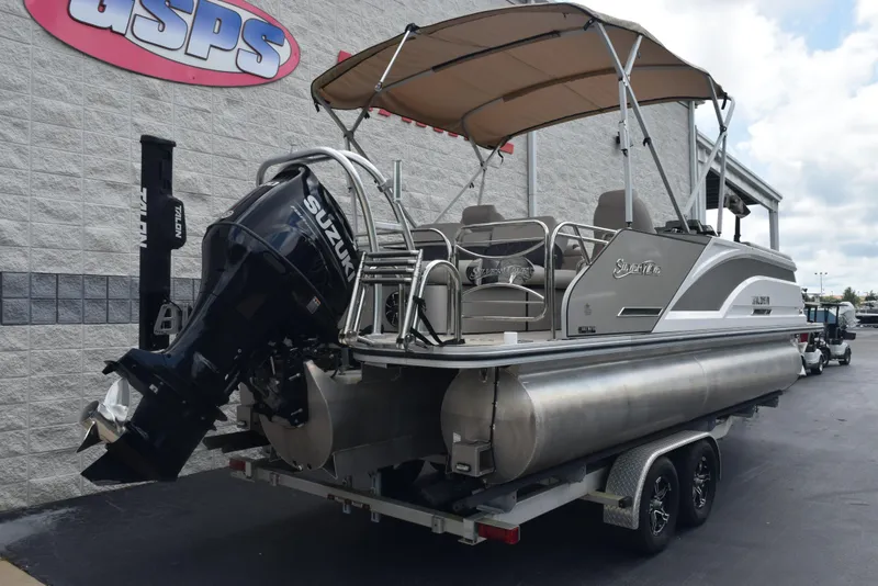 Slide: The Image of 2022 Silver Wave 2410 SW5 JS pontoon boat with Suzuki outboard motor on trailer. - 4