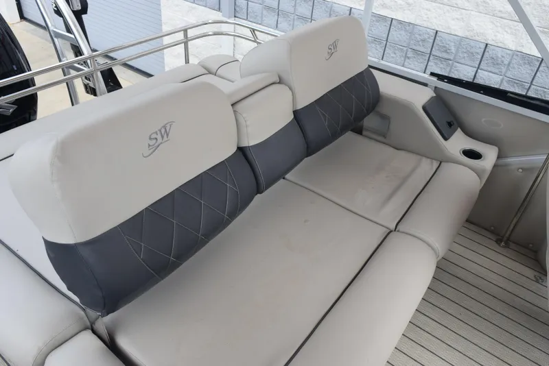 Slide: The Image of 2022 Silver Wave 2410 SW5 JS boat interior with plush seating and elegant design. - 9