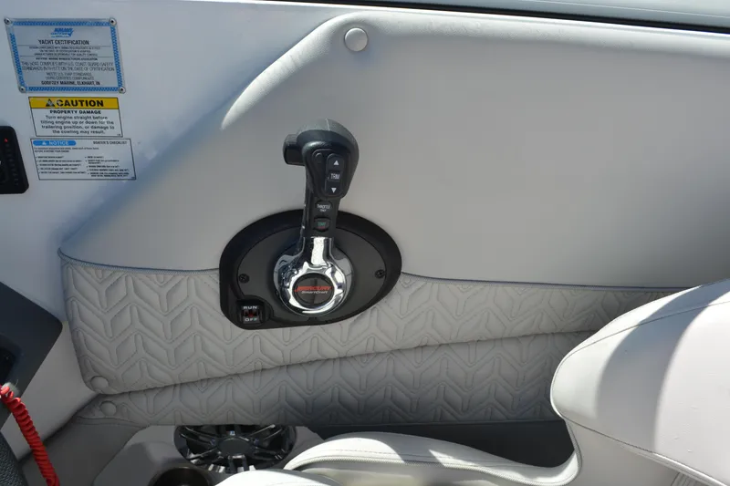 Slide: The Image of Throttle control on 2022 Hurricane SunDeck 2690 OB boat interior. - 13