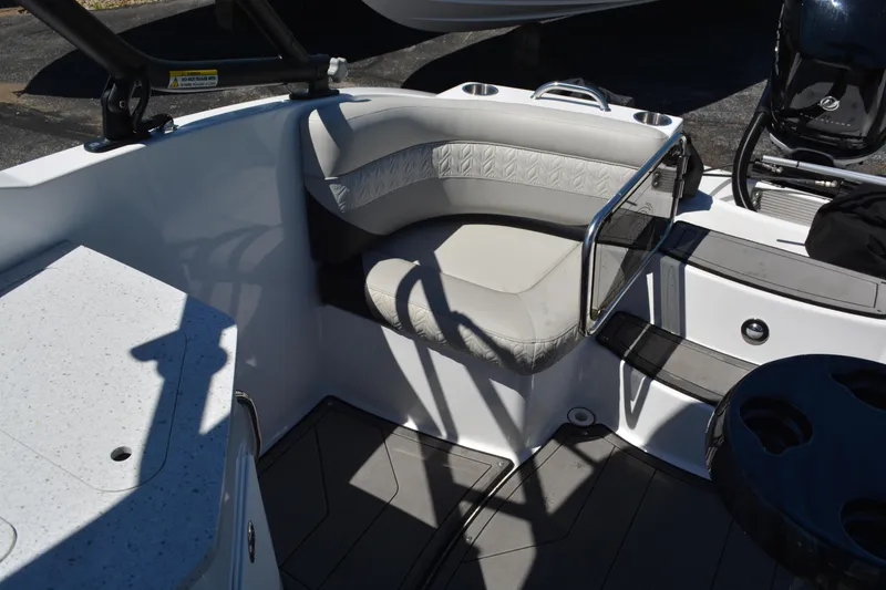 Slide: The Image of 2022 Hurricane SunDeck 2690 OB boat interior with cushioned seating and sleek design. - 17