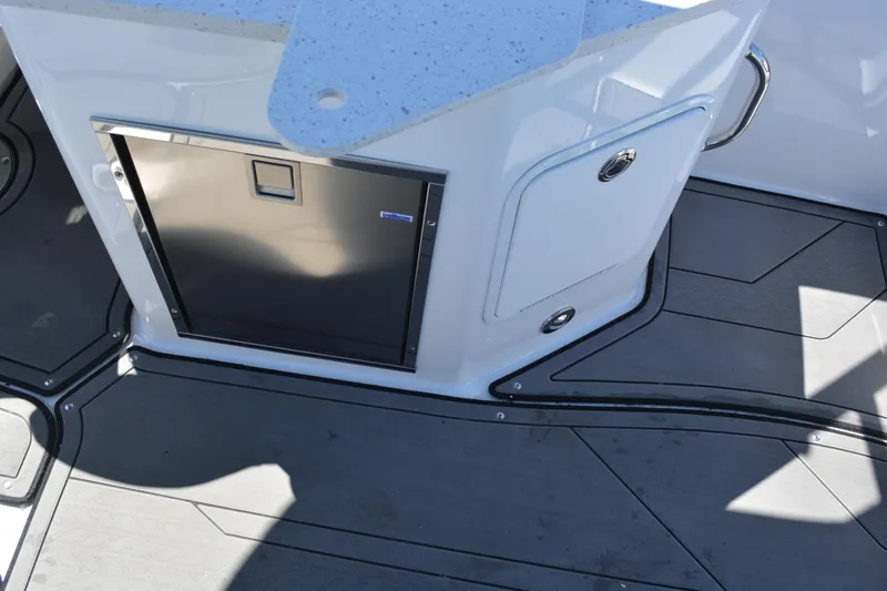 Slide: The Image of 2022 Hurricane SunDeck 2690 OB boat interior with sleek flooring and storage compartments. - 19