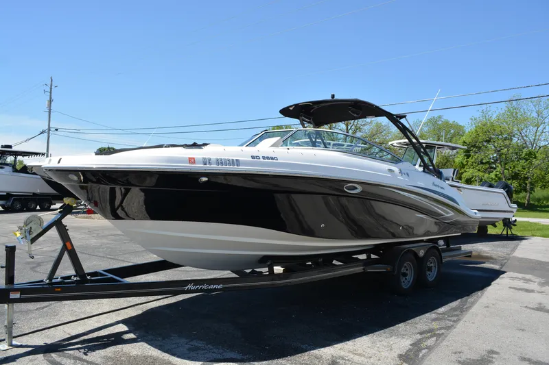 Slide: The Image of 2022 Hurricane SunDeck 2690 OB boat on trailer, parked outdoors. - 6